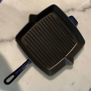 Staub 12” square cast iron blue grill pan. Some scratches on bottom of pan.